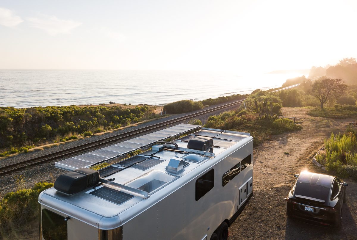 The solar roof of a Living Vehicle seen from above on the coast